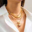 Kit 4 Colares Femininos Trendy Estilo Punk Y2K – Correntes Frisadas Douradas com Pingente de Coração e Fecho OT